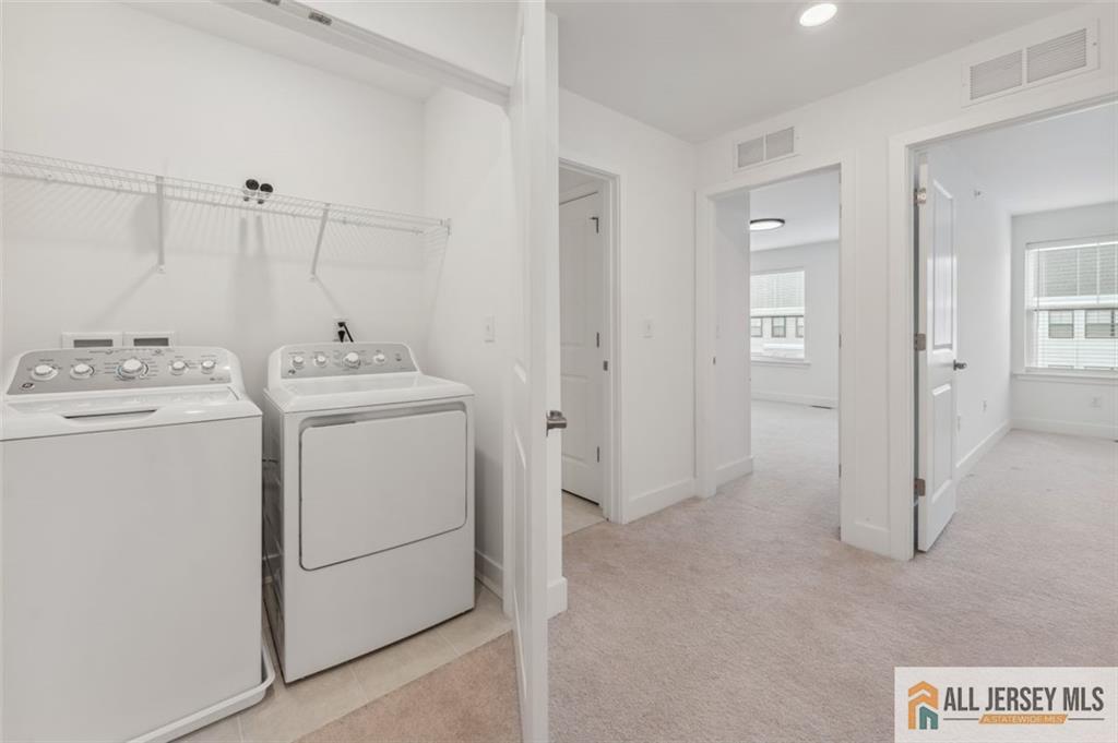 46 Mariveles Way Eatontown, NJ 07724 - Photo 23 of 26 a utility room with dryer and washer
