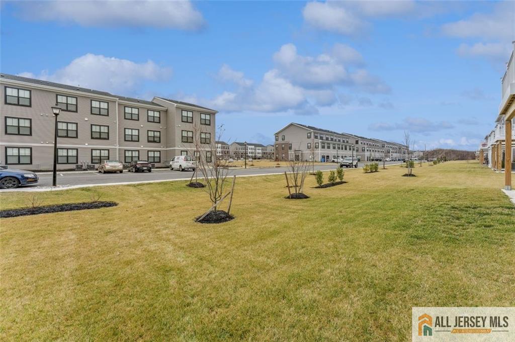 46 Mariveles Way Eatontown, NJ 07724 - Photo 25 of 26 a view of an ocean with a building