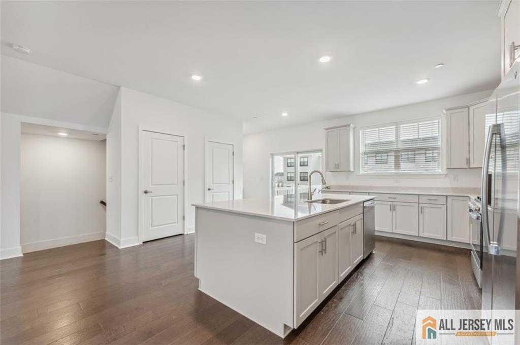 46 Mariveles Way Eatontown, NJ 07724 - Photo 5 of 26 a kitchen with white cabinets and sink