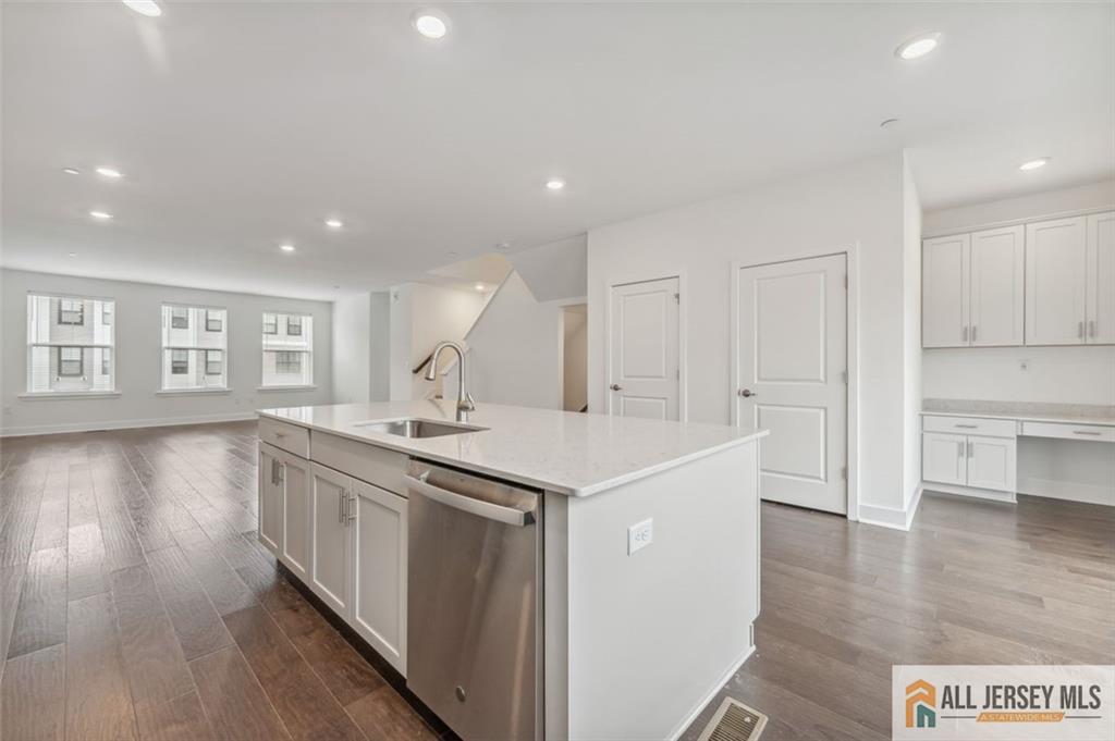46 Mariveles Way Eatontown, NJ 07724 - Photo 7 of 26 a kitchen with a sink and wooden floor