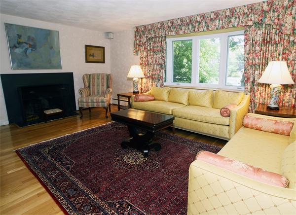 19 Tyler Road Lexington, MA 02420 - Photo 4 of 19 a living room with furniture large window and a fireplace