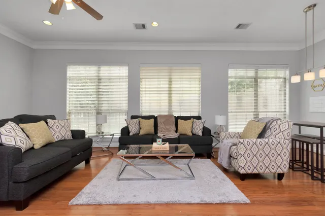 a living room with furniture and a large window