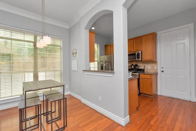 a view of kitchen with furniture and wooden floor