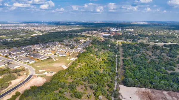 a view of a yard next to a yard