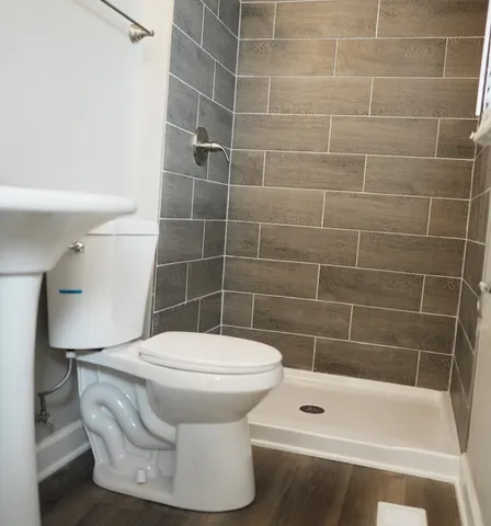 a bathroom with a toilet and a bathtub