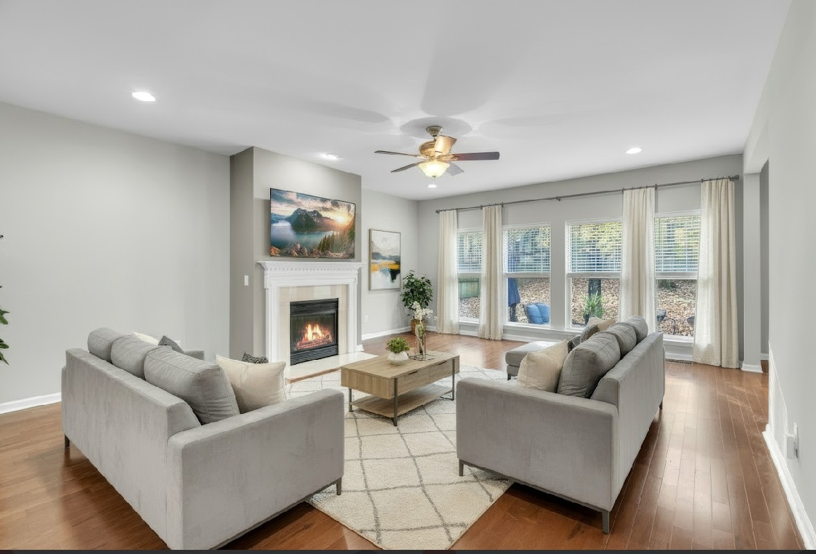 3924 Signature Court Smyrna, TN 37167 - Photo 12 of 35 a living room with furniture a fireplace and a large window