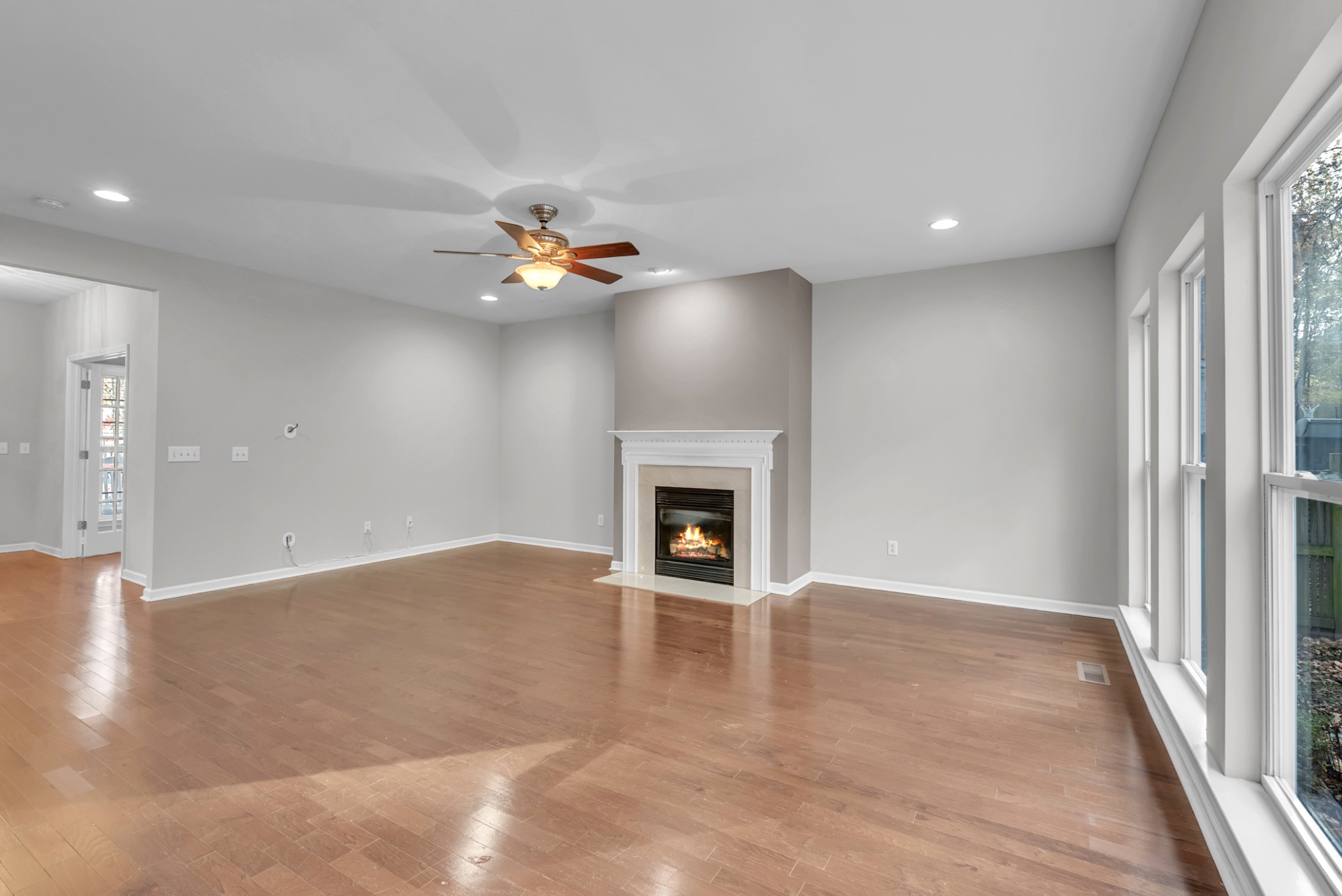 3924 Signature Court Smyrna, TN 37167 - Photo 14 of 35 wooden floor in an empty room with a fireplace