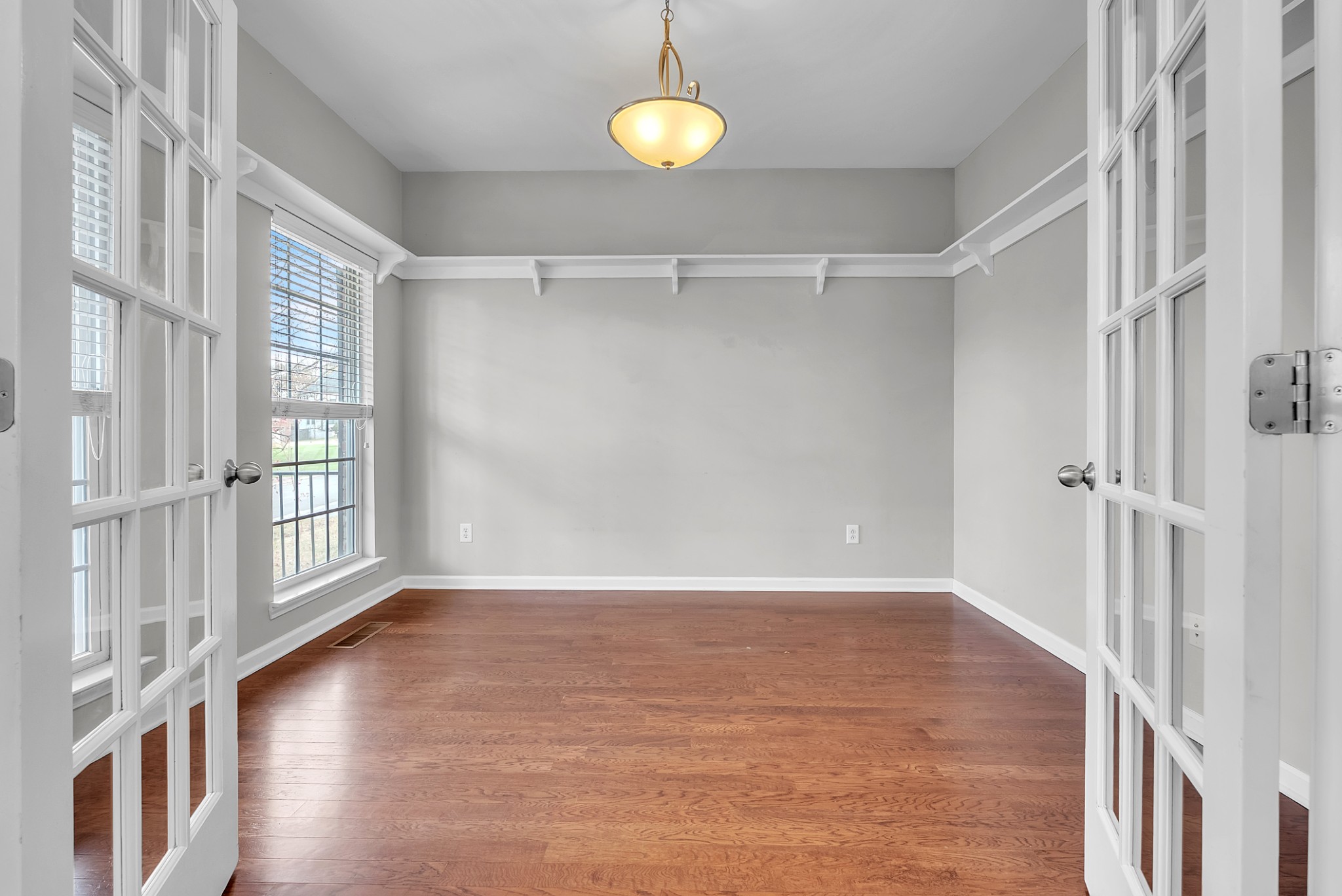 3924 Signature Court Smyrna, TN 37167 - Photo 18 of 35 a view of an empty room with wooden floor and a window