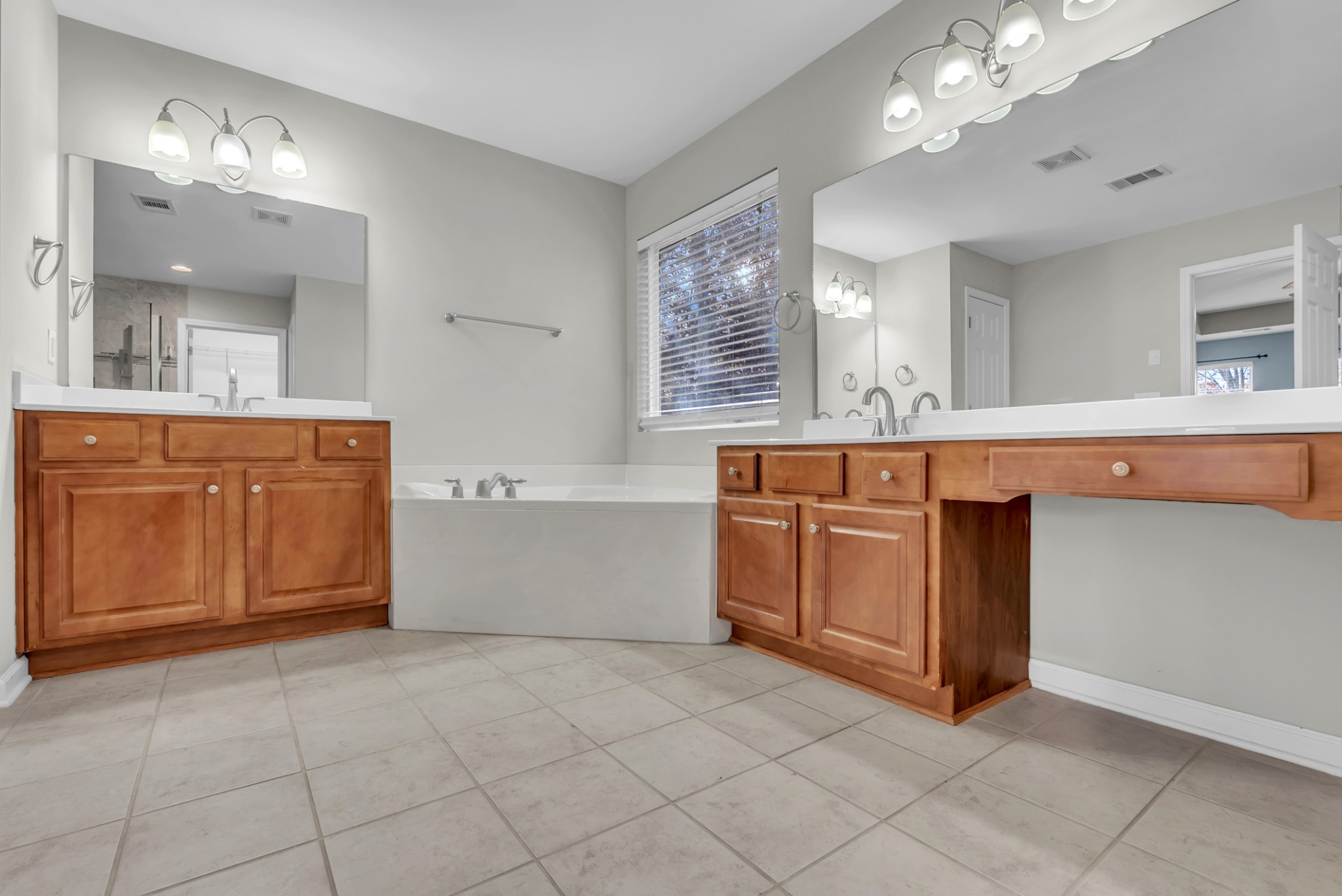 3924 Signature Court Smyrna, TN 37167 - Photo 26 of 35 a spacious bathroom with a sink vanity and mirror