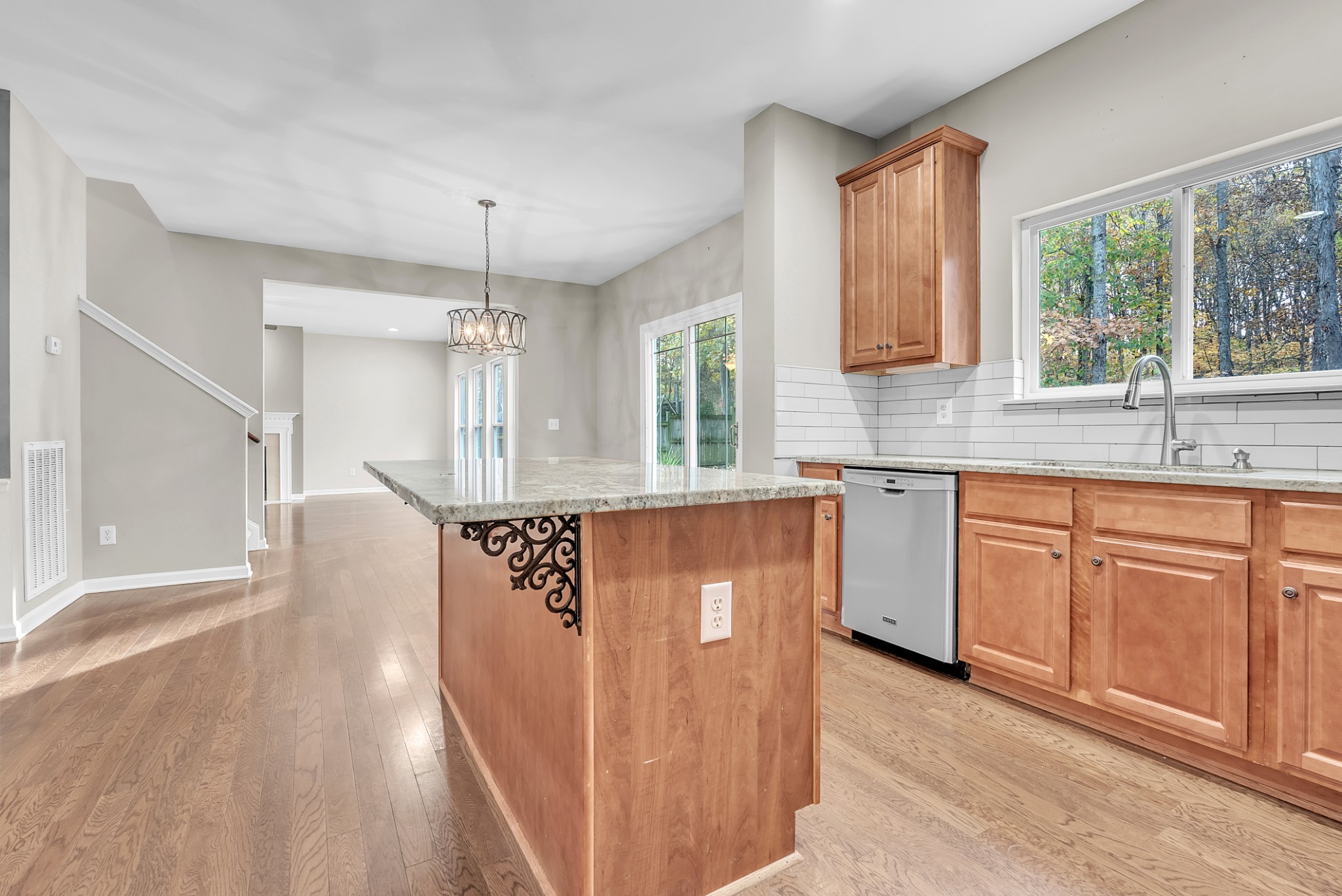 3924 Signature Court Smyrna, TN 37167 - Photo 8 of 35 a kitchen with kitchen island granite countertop a sink cabinets and window