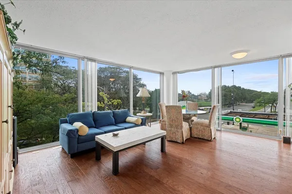 a living room with furniture and a large window