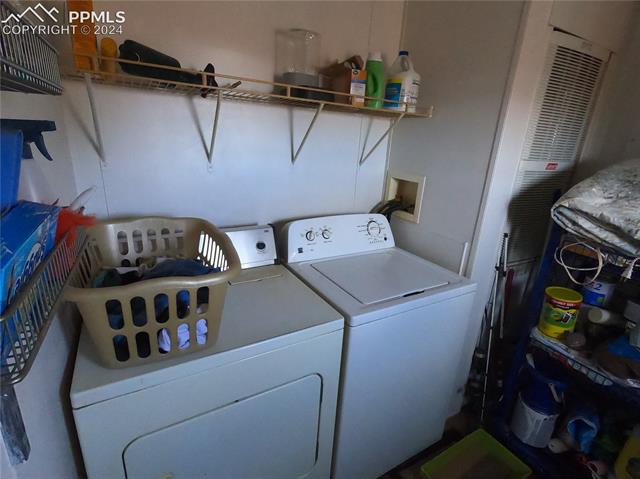 609 3rd Avenue Romeo, CO 81148 - Photo 14 of 16 Laundry room with separate washer and dryer and hookup for a washing machine