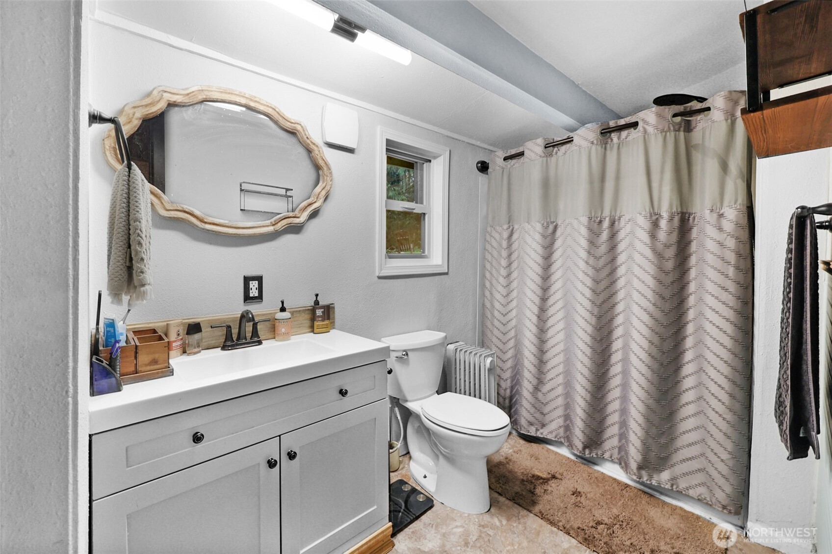 13109 Crystal Springs Road Granite Falls, WA 98252 - Photo 20 of 32 a bathroom with a granite countertop sink mirror vanity and toilet