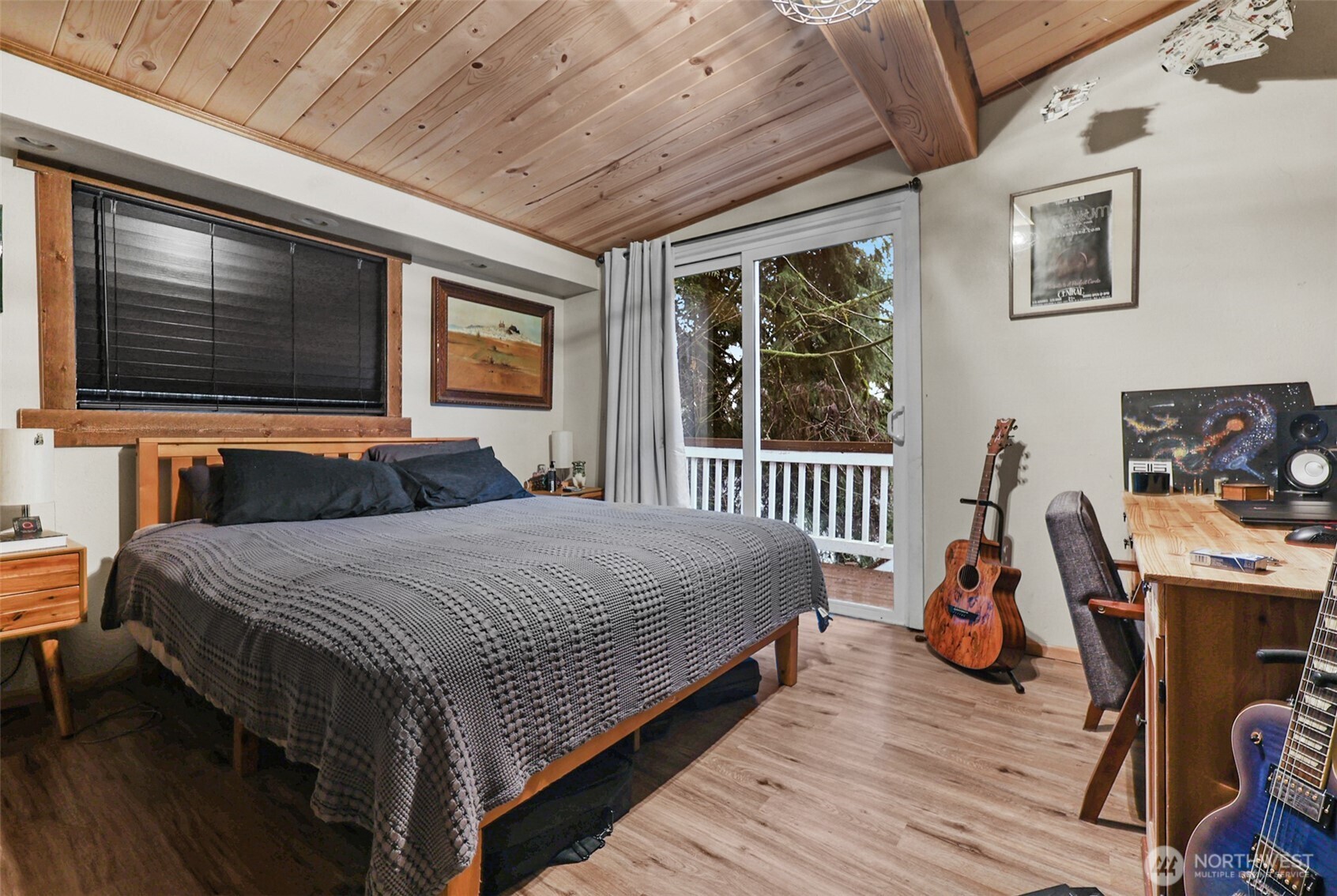 13109 Crystal Springs Road Granite Falls, WA 98252 - Photo 8 of 32 a bedroom with a bed and wooden floor