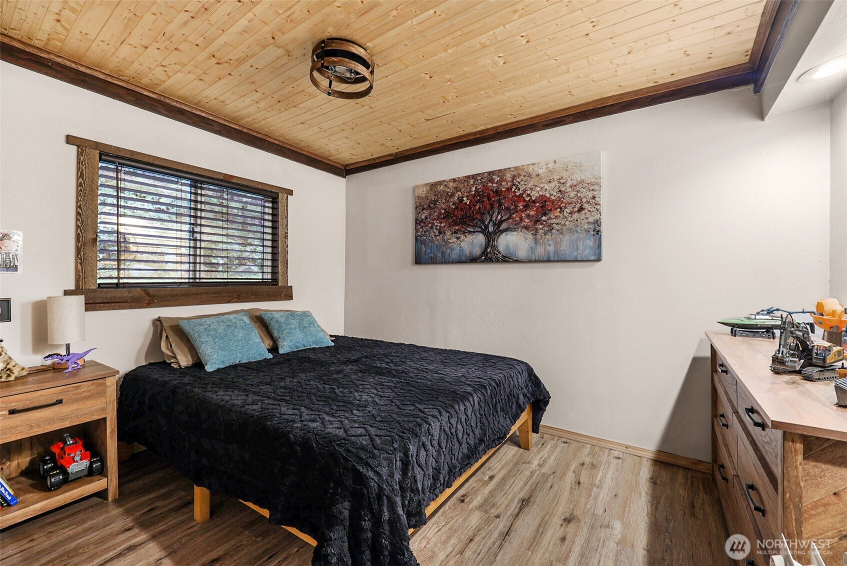 13109 Crystal Springs Road Granite Falls, WA 98252 - Photo 10 of 32 a bedroom with a bed and wooden floor