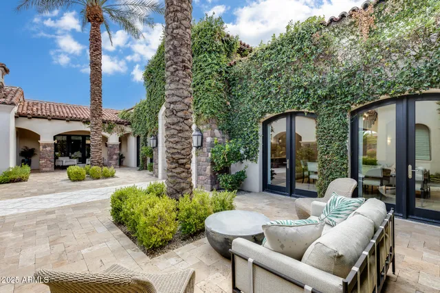 a large kitchen with a table and chairs