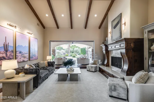 a living room with furniture fireplace and flat screen tv