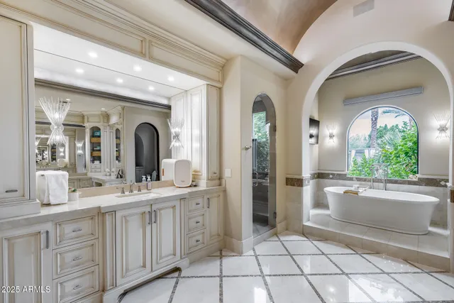 a view of a porch with furniture and a potted plant