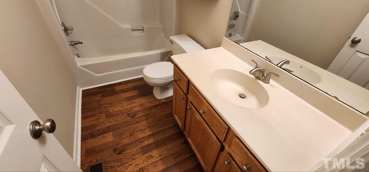 745 Brewer Circle Wake Forest, NC 27587 - Photo 11 of 18 a bathroom with a sink and toilet