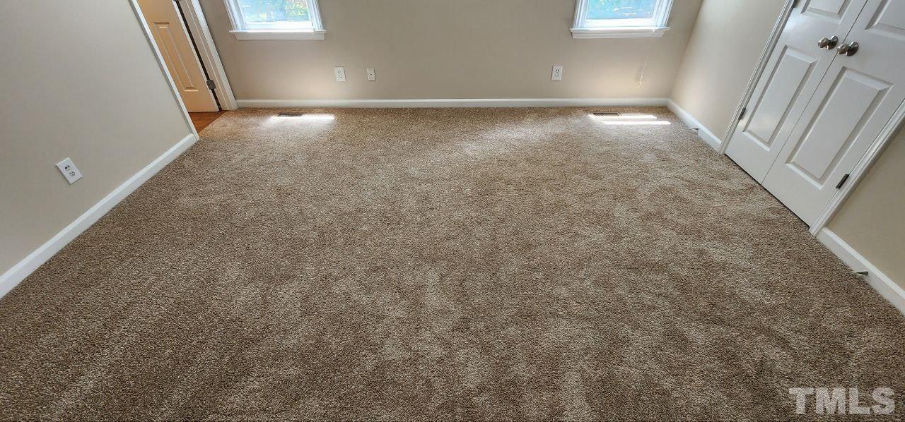 745 Brewer Circle Wake Forest, NC 27587 - Photo 14 of 18 a view of an empty room and a window