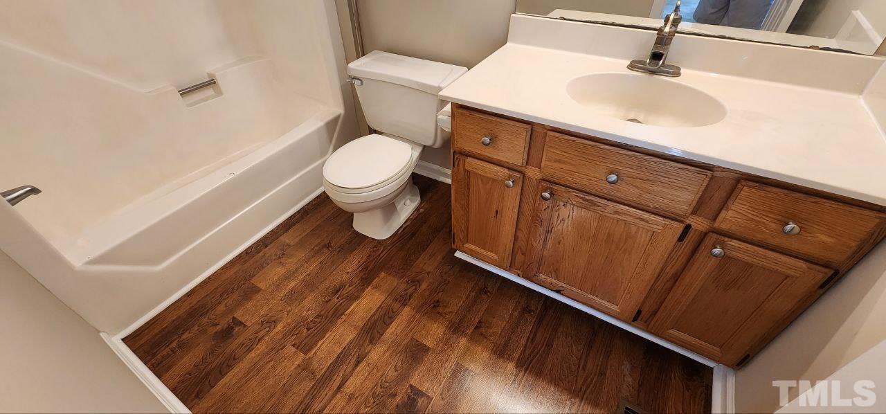 745 Brewer Circle Wake Forest, NC 27587 - Photo 15 of 18 a bathroom with a sink and a mirror