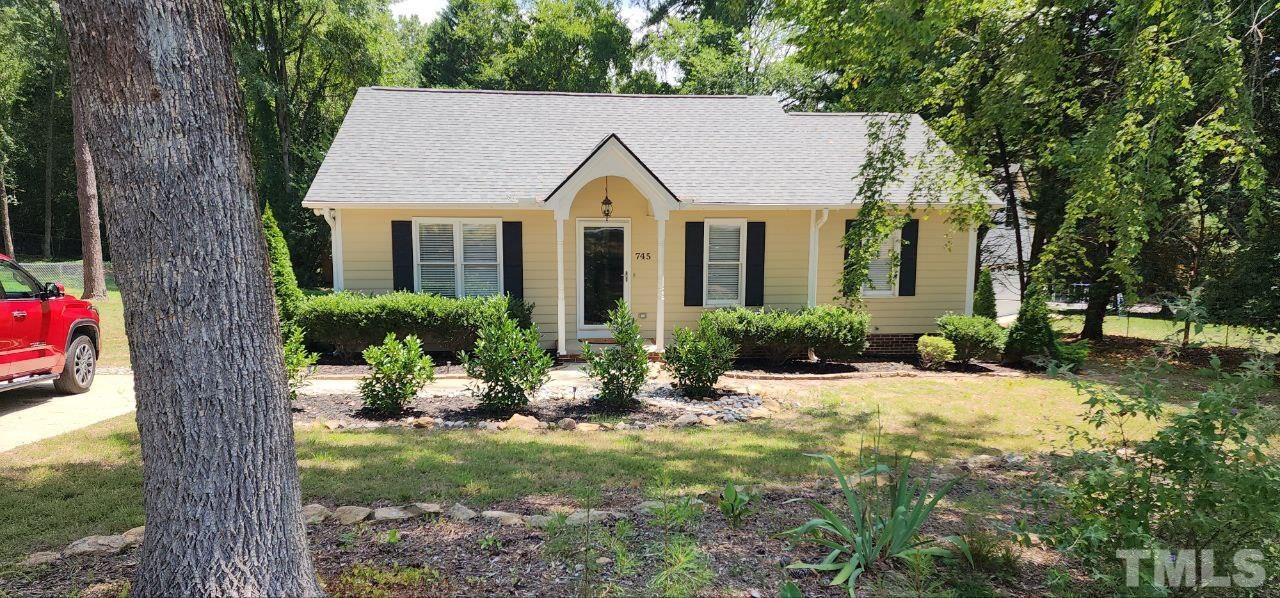 745 Brewer Circle Wake Forest, NC 27587 - Photo 2 of 18 a view of a house with a yard and large tree