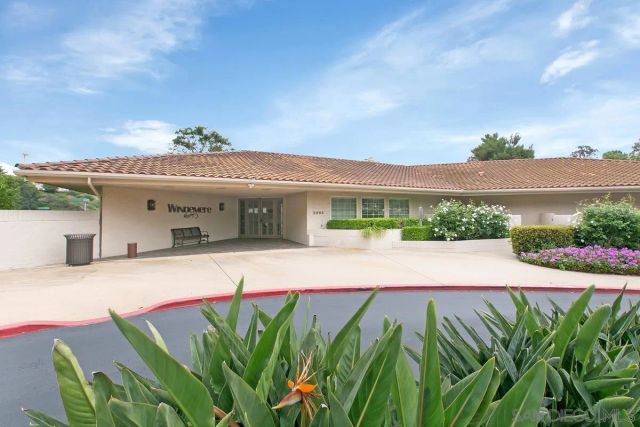a view of a house with pool and a yard