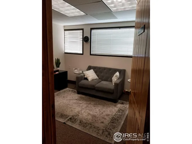 a workspace with furniture and window