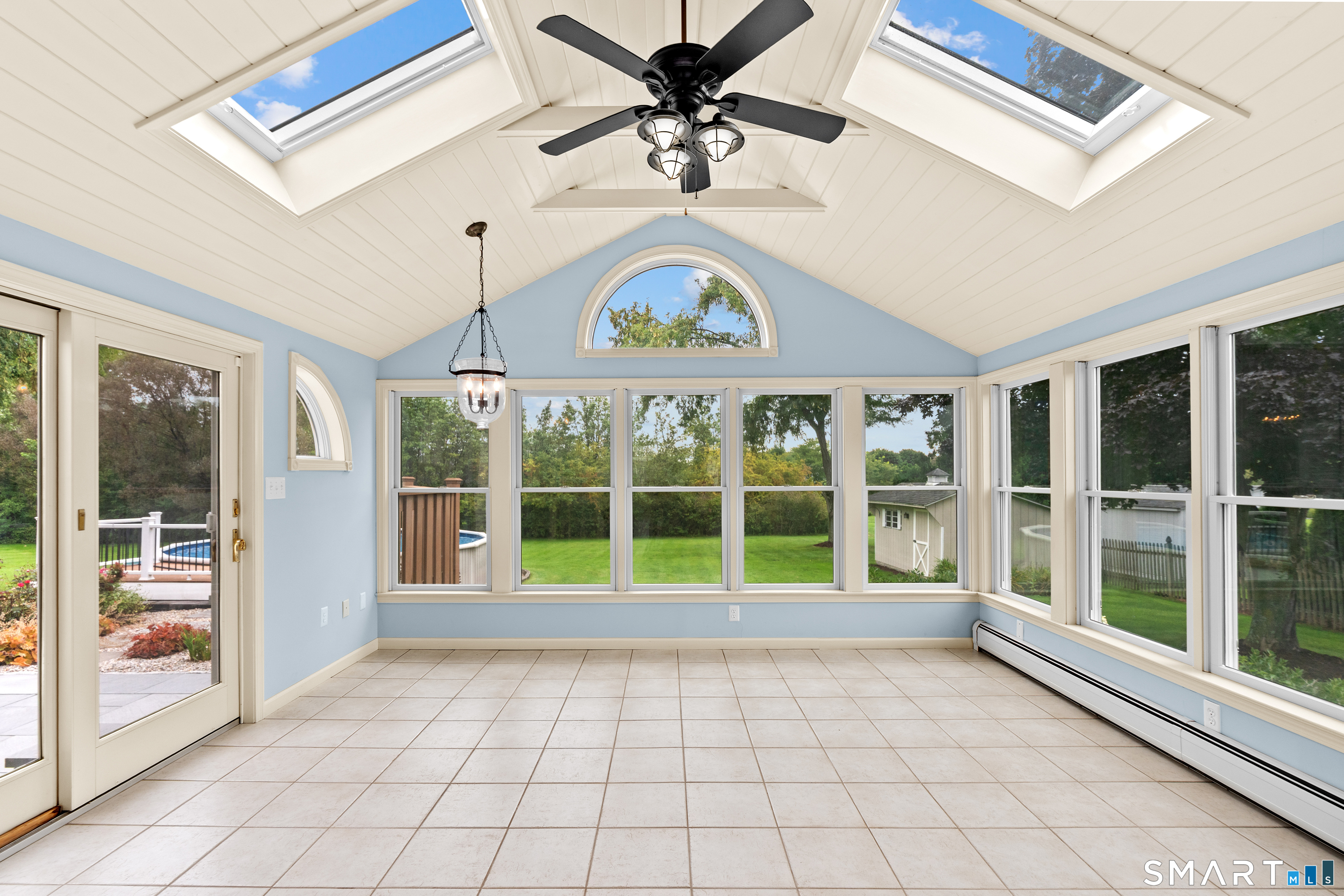71 Quail Run Road Suffield, CT 06078 - Photo 22 of 40 Beautiful sunroom to enjoy all year round.
