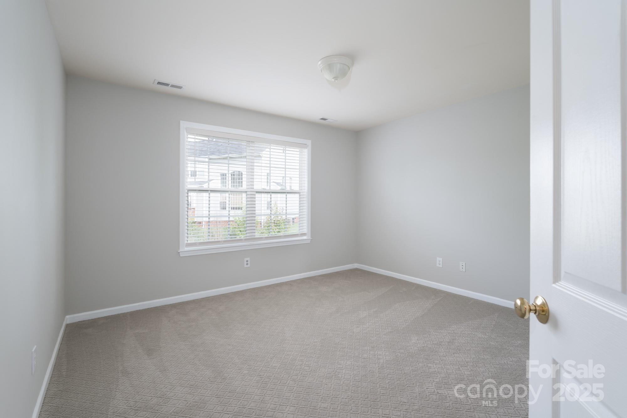 4392 Sunset Rose Drive Fort Mill, SC 29708 - Photo 12 of 39 an empty room with a window