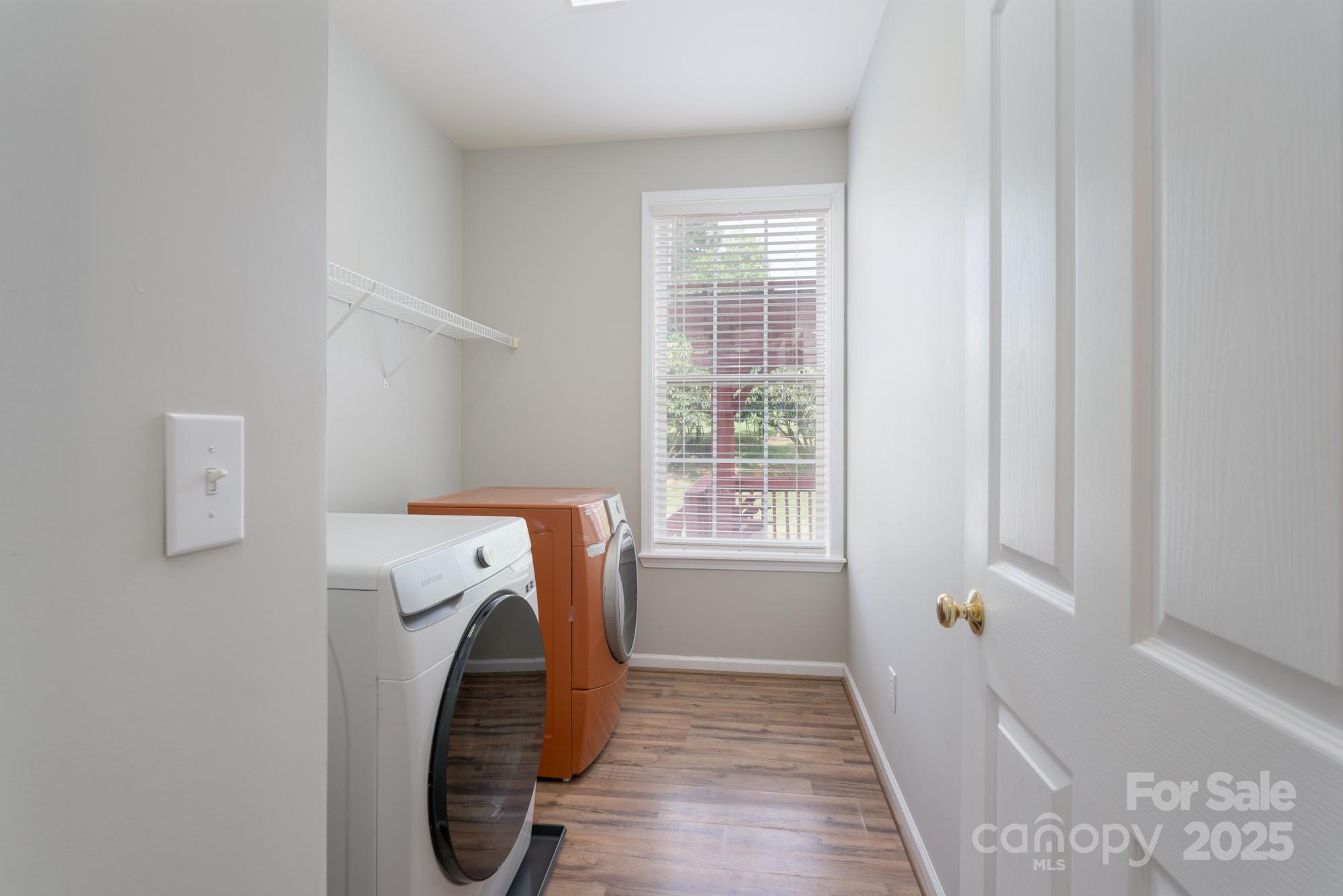 4392 Sunset Rose Drive Fort Mill, SC 29708 - Photo 14 of 39 a utility room with a window dryer and washer
