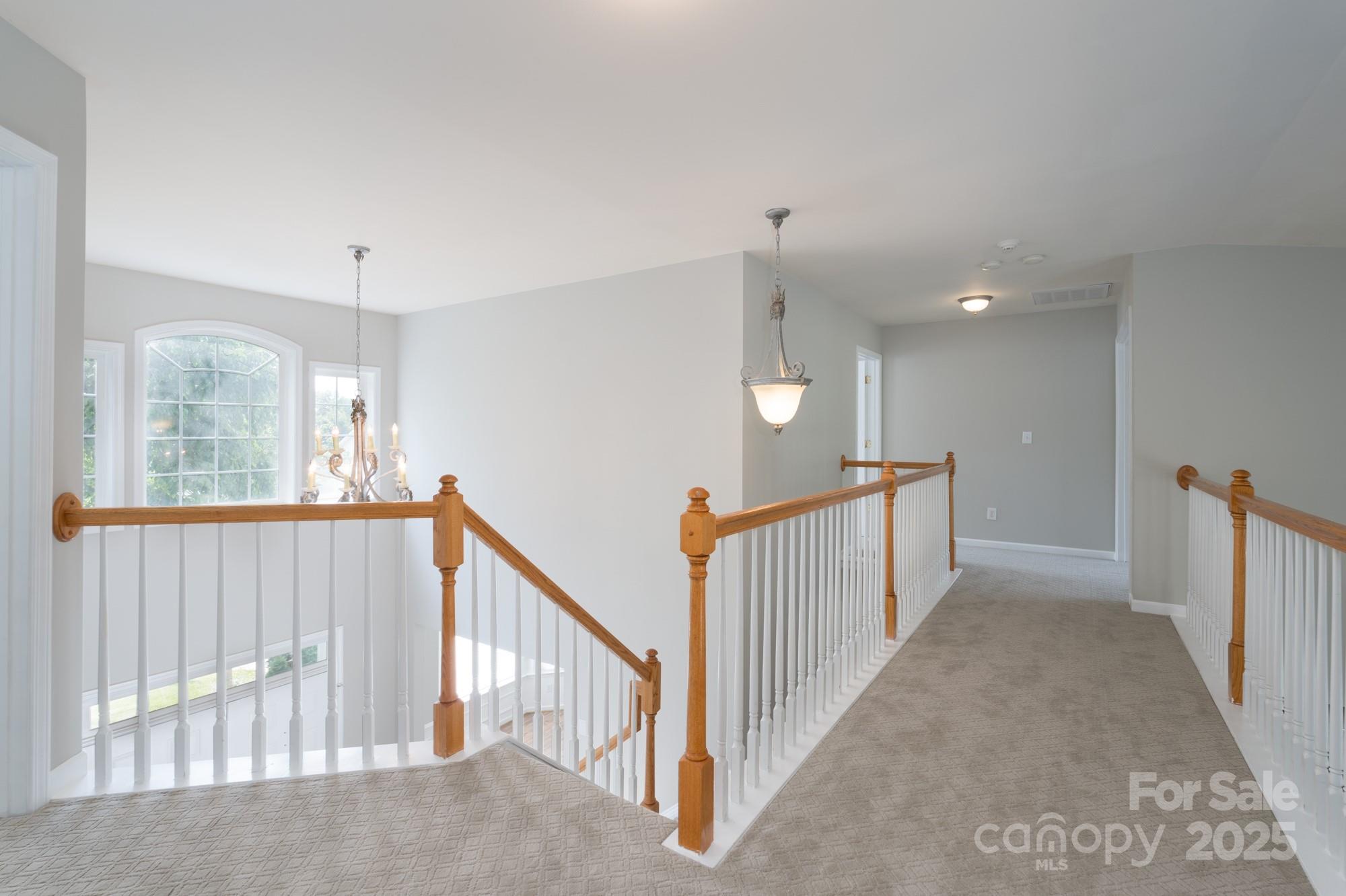 4392 Sunset Rose Drive Fort Mill, SC 29708 - Photo 16 of 39 a view of a hallway with windows