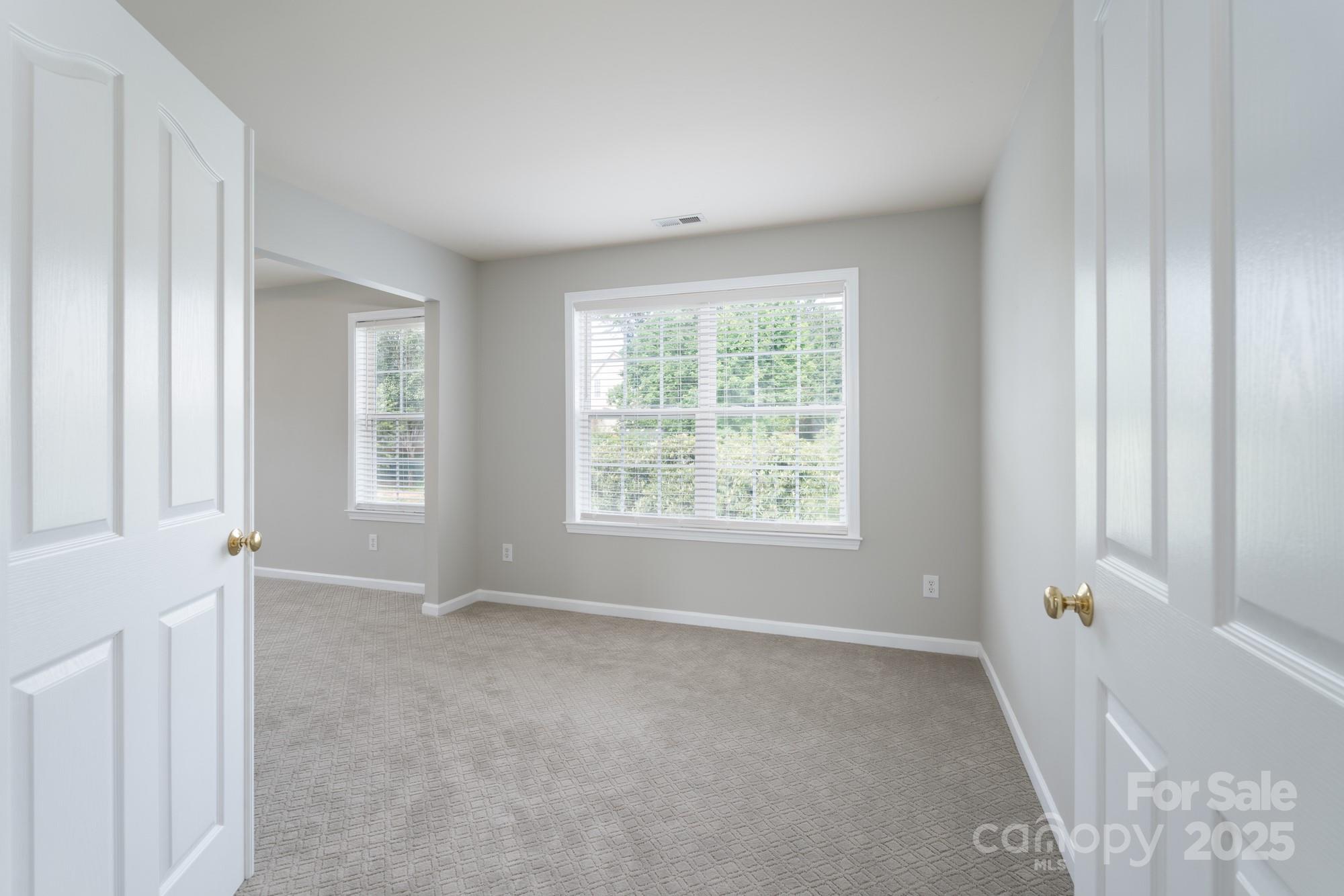 4392 Sunset Rose Drive Fort Mill, SC 29708 - Photo 18 of 39 a view of an empty room with a window