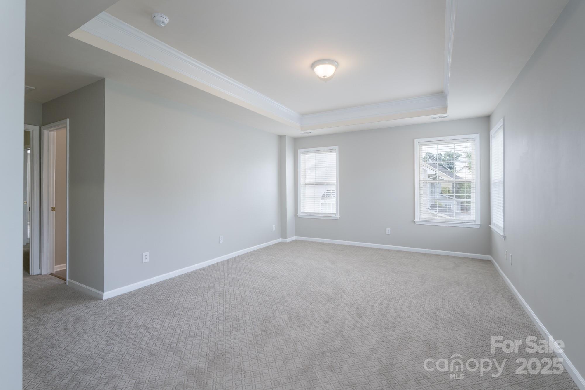 4392 Sunset Rose Drive Fort Mill, SC 29708 - Photo 19 of 39 a view of an empty room with a window
