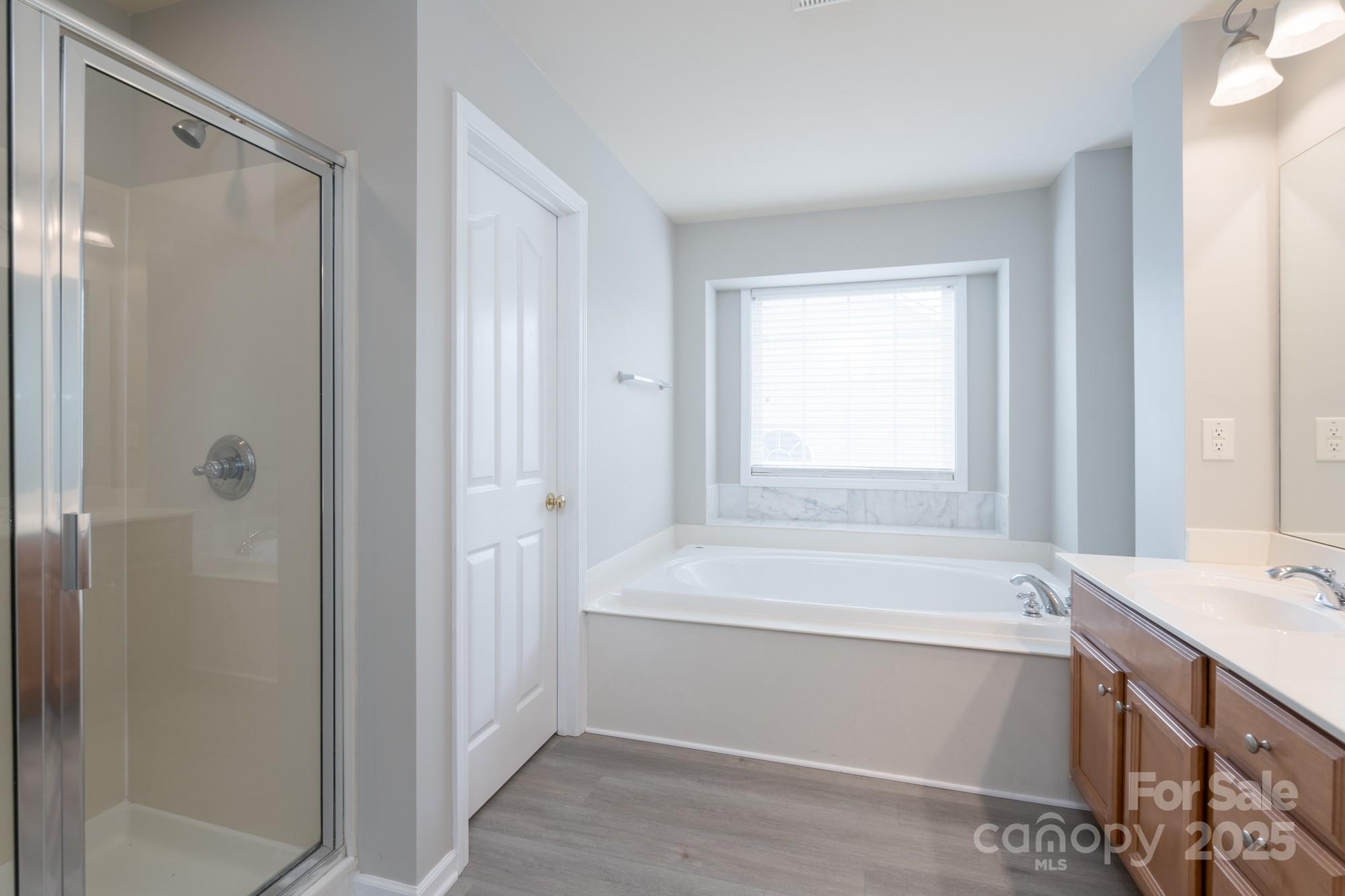 4392 Sunset Rose Drive Fort Mill, SC 29708 - Photo 24 of 39 a bathroom with a bathtub and a sink