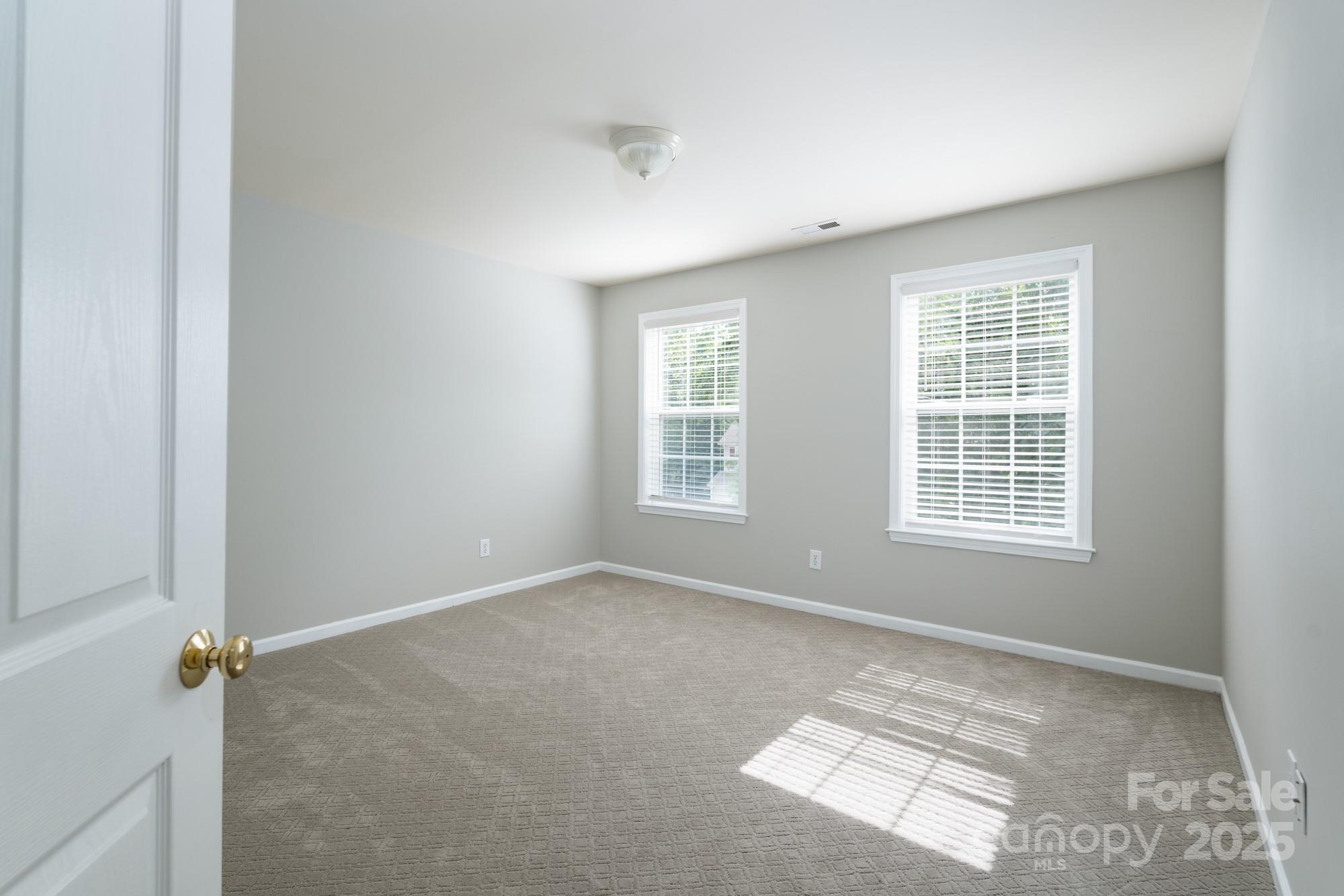 4392 Sunset Rose Drive Fort Mill, SC 29708 - Photo 25 of 39 a view of a room that has a window in it