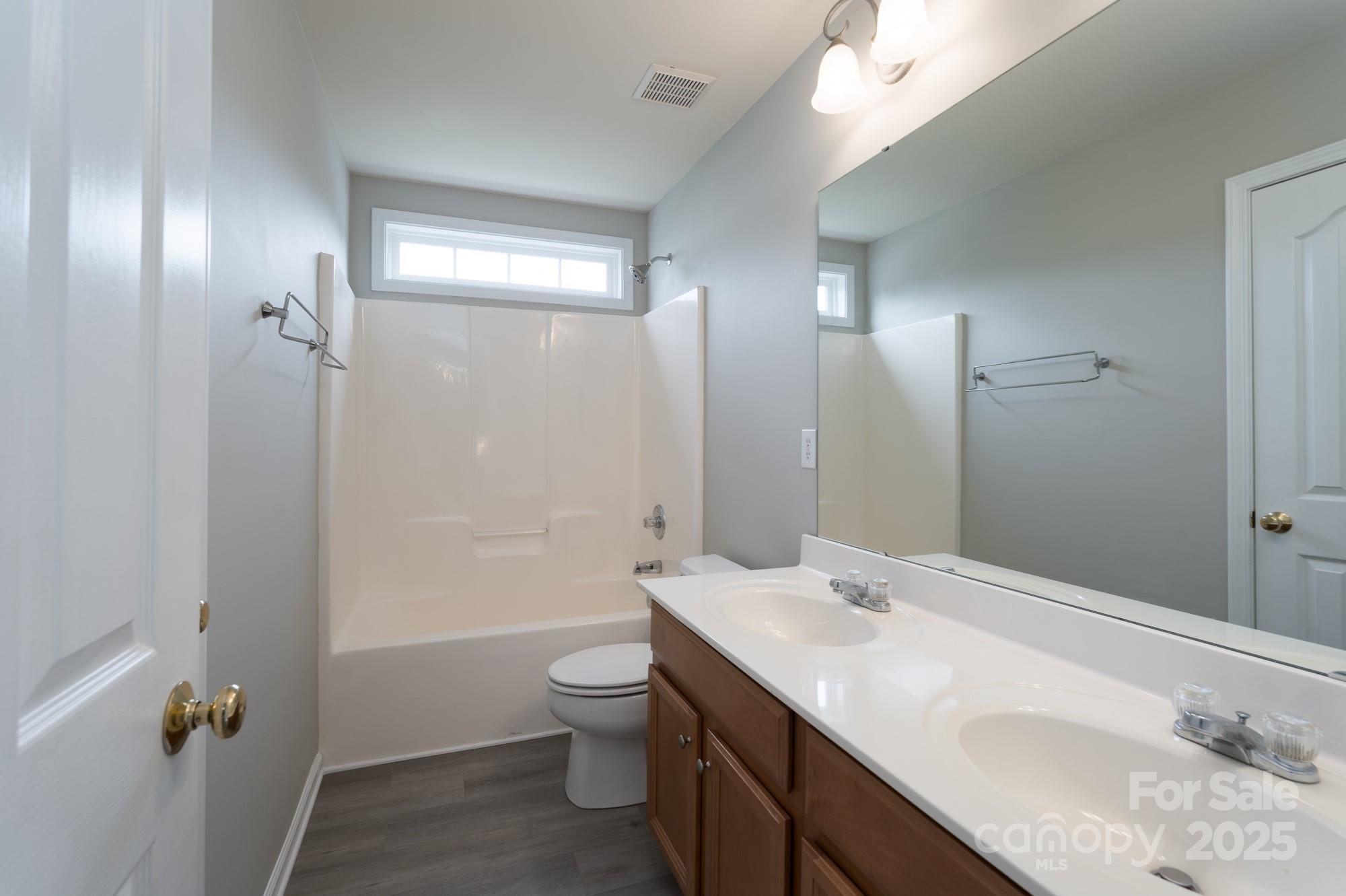 4392 Sunset Rose Drive Fort Mill, SC 29708 - Photo 28 of 39 a bathroom with a sink a toilet and shower