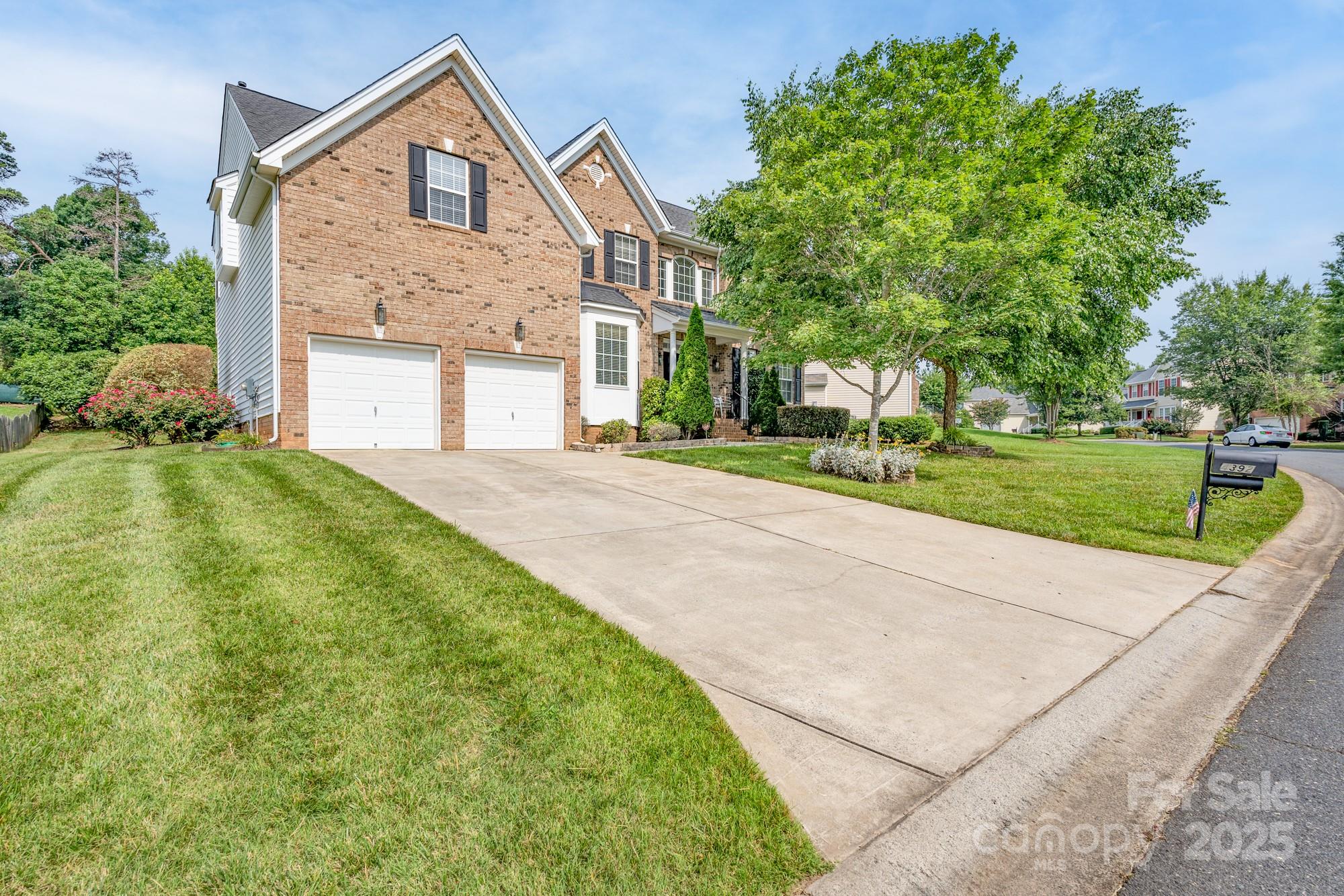 4392 Sunset Rose Drive Fort Mill, SC 29708 - Photo 29 of 39 a front view of a house with a yard and garage