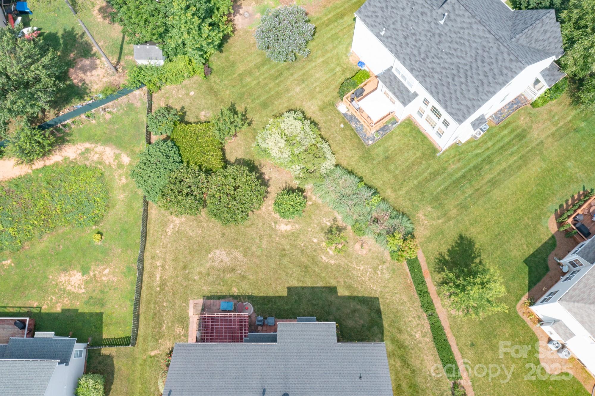 4392 Sunset Rose Drive Fort Mill, SC 29708 - Photo 34 of 39 an aerial view of a house with a yard