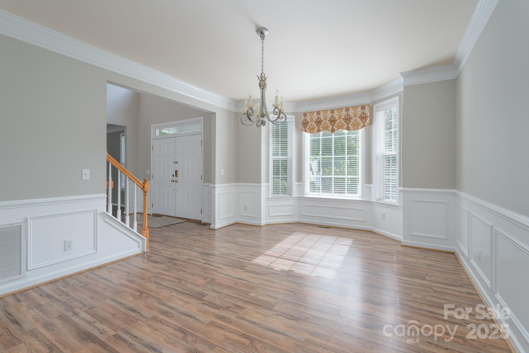 4392 Sunset Rose Drive Fort Mill, SC 29708 - Photo 8 of 39 a view of an empty room with wooden floor and a window