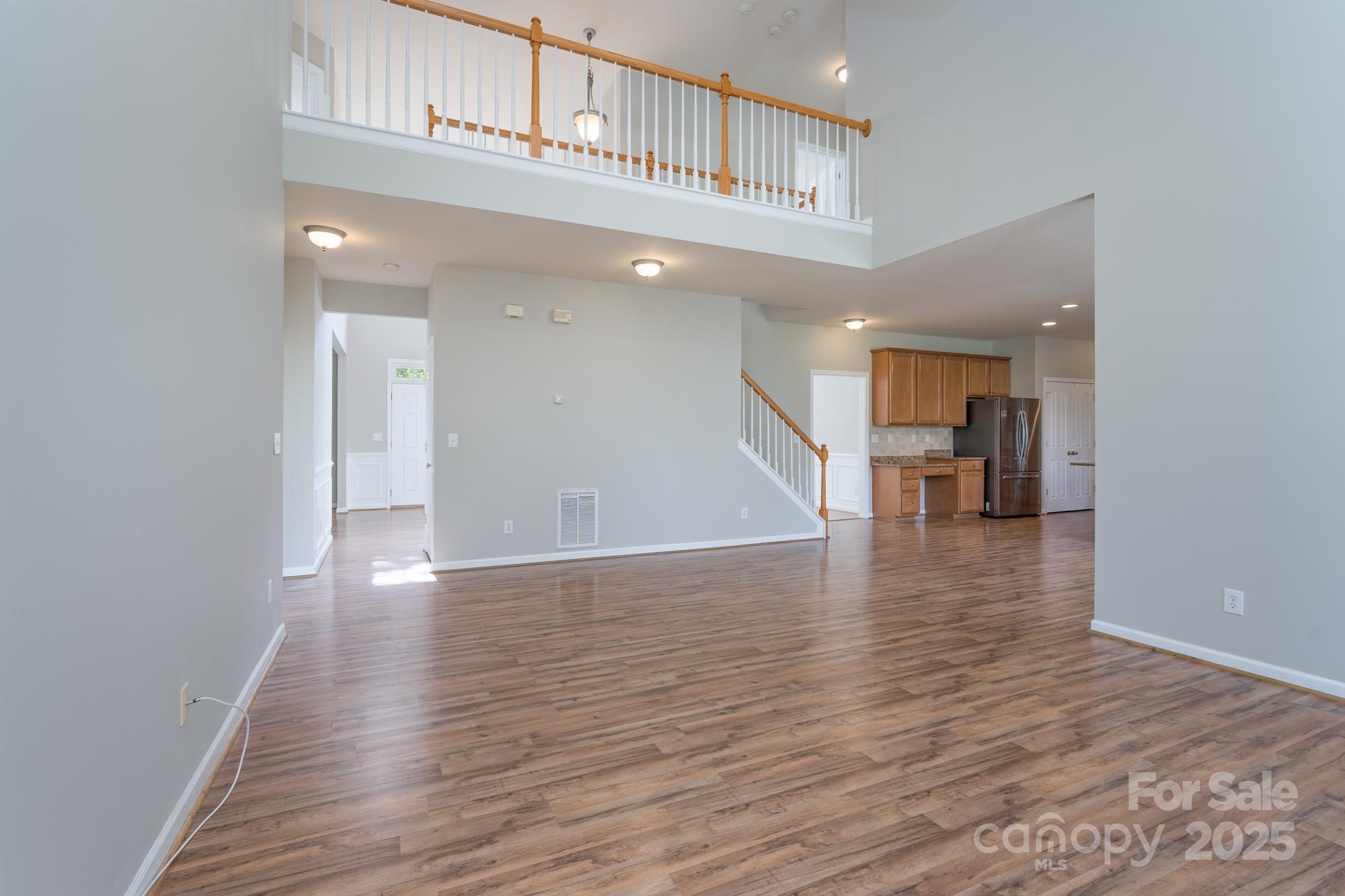 4392 Sunset Rose Drive Fort Mill, SC 29708 - Photo 9 of 39 a view of a hallway with wooden floor