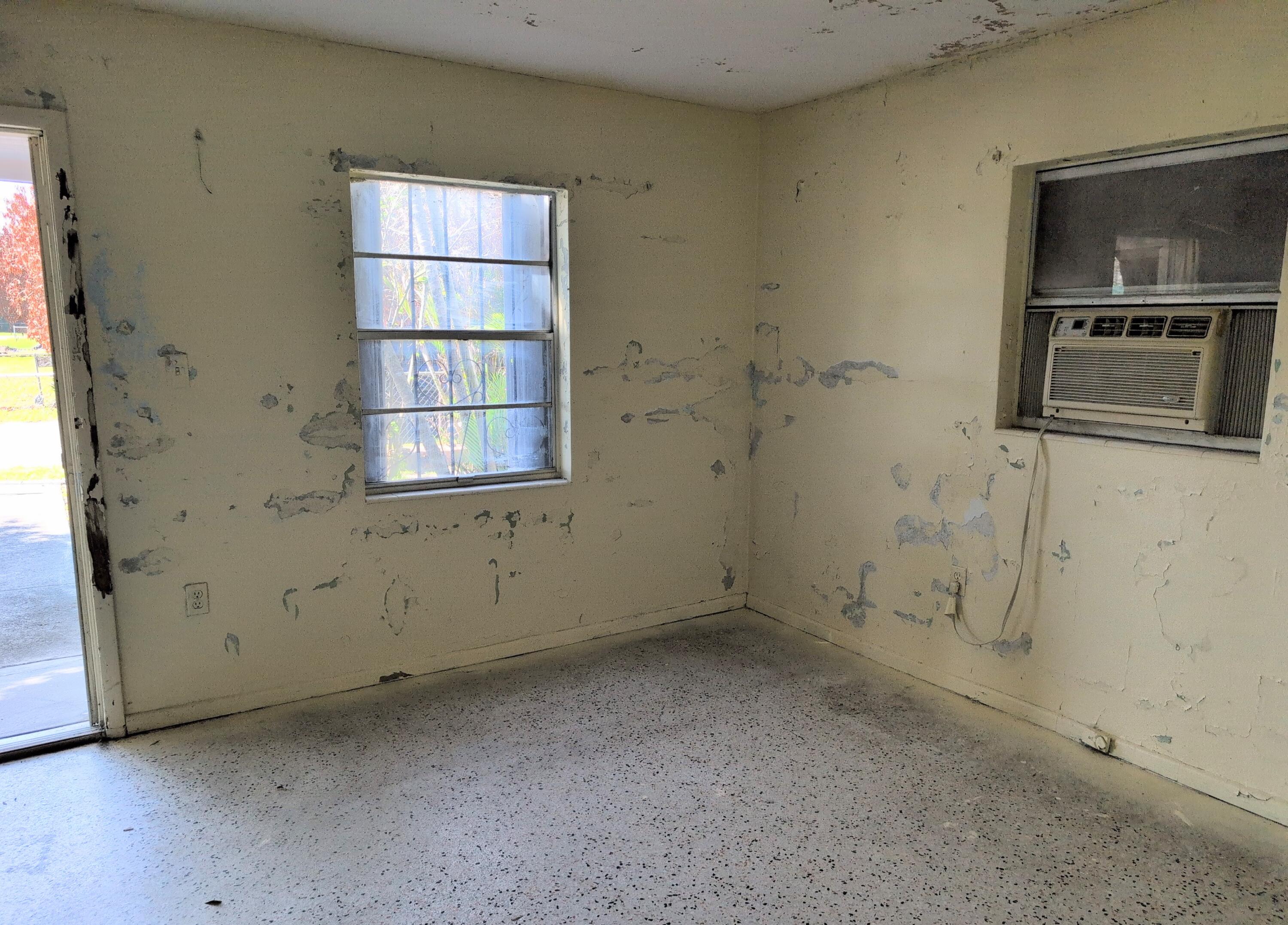 1606 Ave H Fort Pierce, FL 34950 - Photo 8 of 9 an empty room with windows