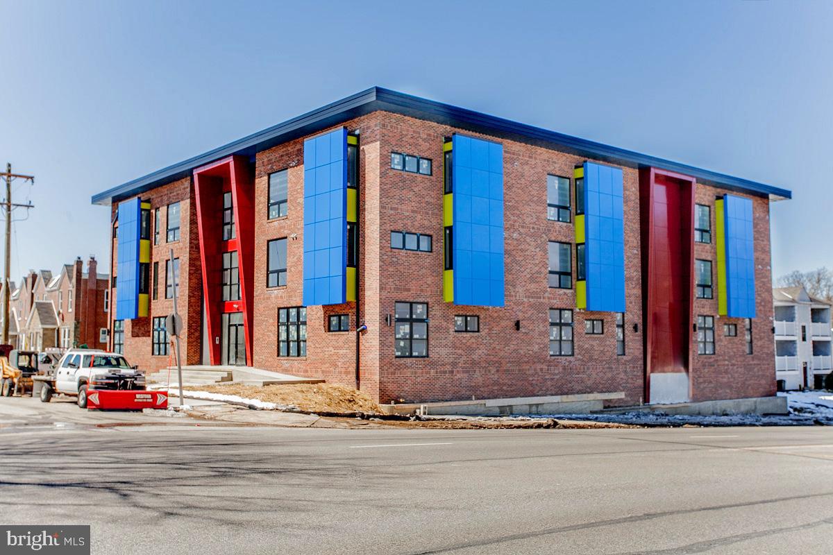 5938 Henry Avenue, Unit 21 Philadelphia, PA 19128 - Photo 1 of 19 a view of a building with street view