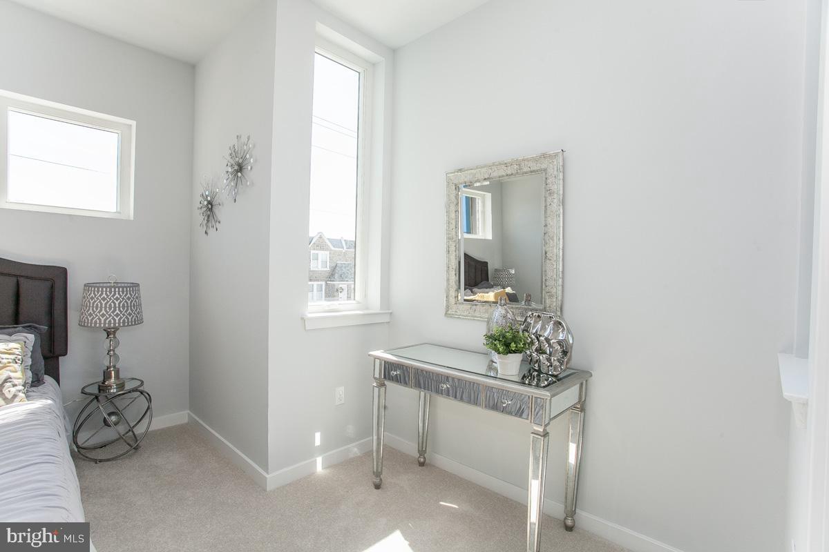5938 Henry Avenue, Unit 21 Philadelphia, PA 19128 - Photo 14 of 19 a room with table and chair