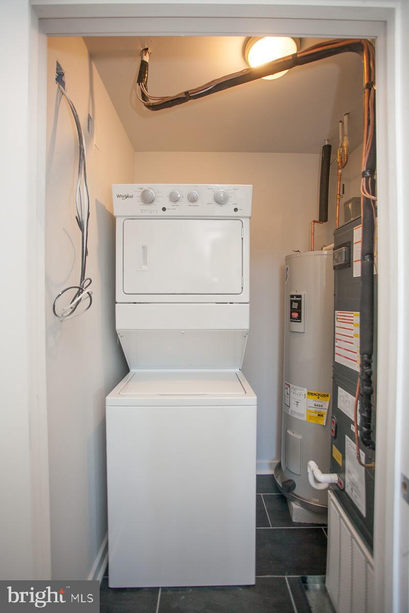 5938 Henry Avenue, Unit 21 Philadelphia, PA 19128 - Photo 19 of 19 a utility room with dryer and washer
