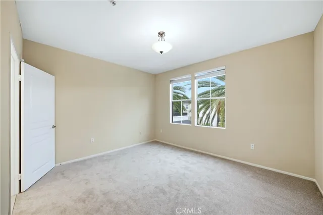 a view of an empty room with windows