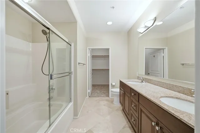 a bathroom with a granite countertop sink mirror and double