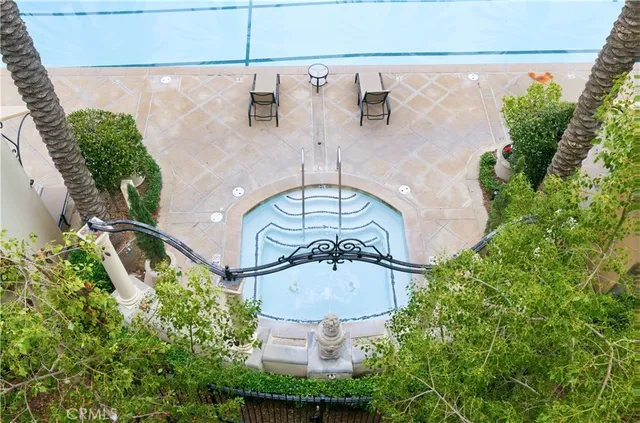 an aerial view of a house with a swimming pool