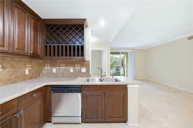 a kitchen with a sink cabinets and window