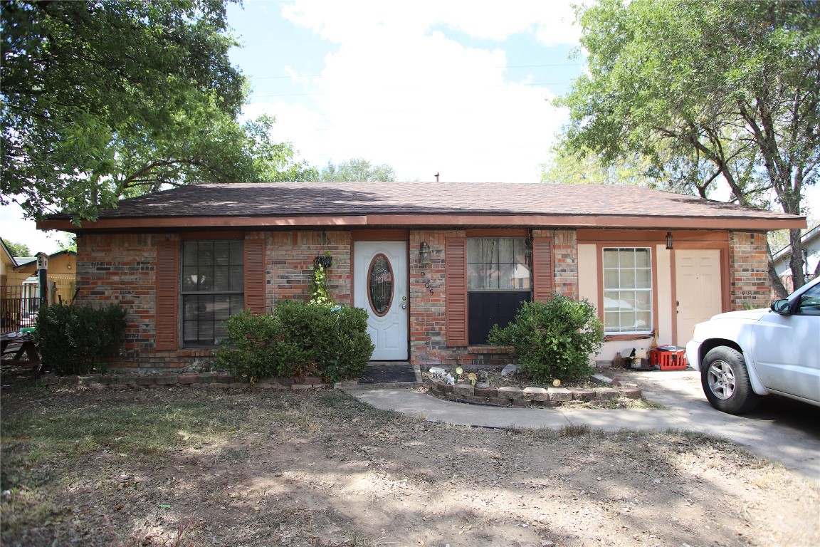 905 Luann Lane Lockhart, TX 78644 - Photo 1 of 1 View of front of property with brick siding and roof with shingles
